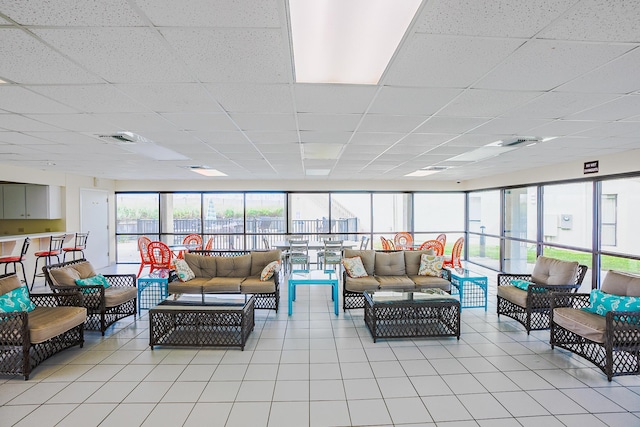 interior space featuring a paneled ceiling and visible vents