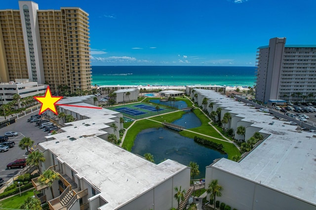 bird's eye view featuring a view of the beach and a water view