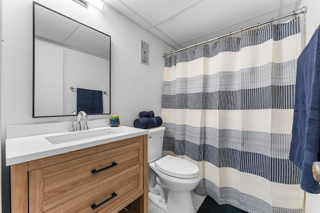 bathroom with vanity, curtained shower, and toilet