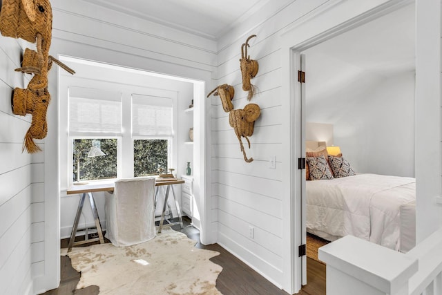 interior space with baseboards and dark wood-style flooring