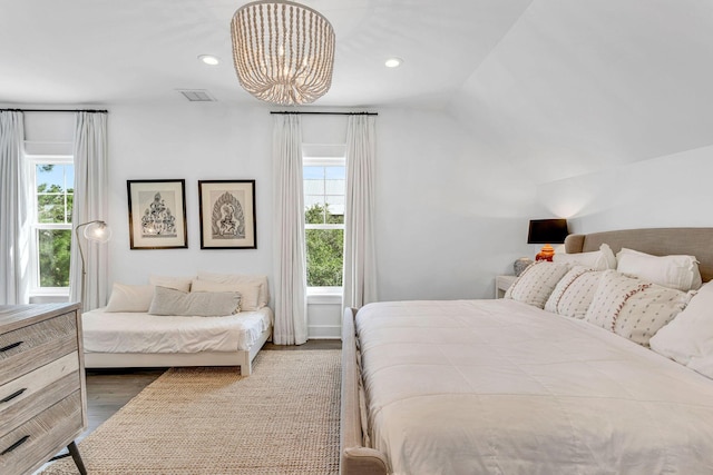 bedroom featuring dark wood finished floors, vaulted ceiling, recessed lighting, and visible vents