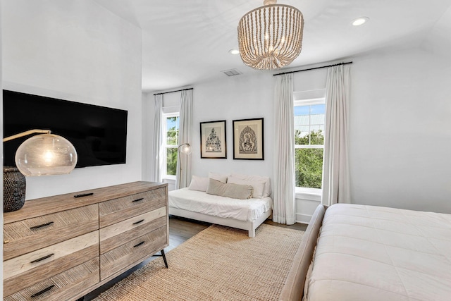 bedroom with recessed lighting, visible vents, multiple windows, and a notable chandelier