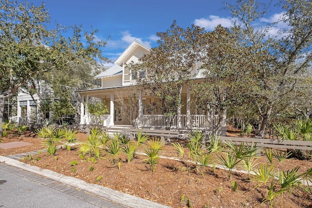 view of front of house with metal roof and covered porch