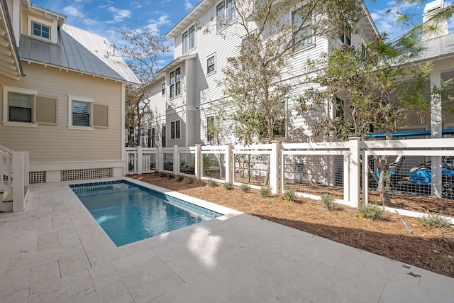 view of swimming pool featuring a fenced in pool, a patio, and fence