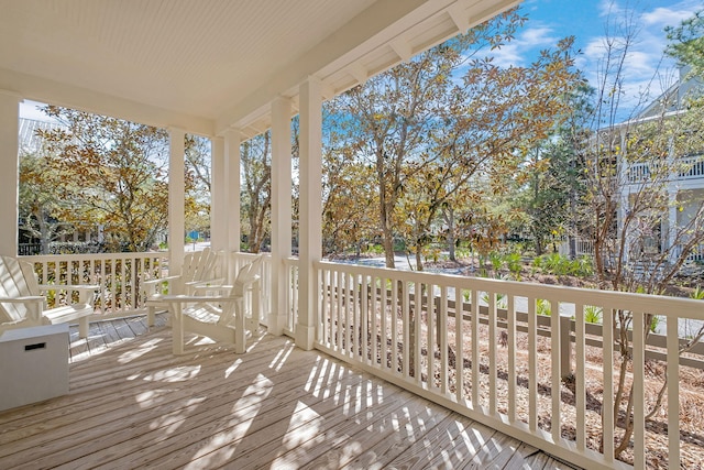 wooden terrace featuring a porch