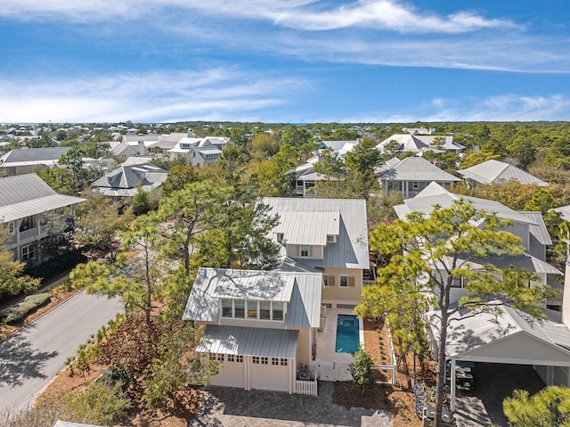 birds eye view of property with a residential view