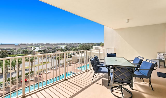 balcony featuring outdoor dining area