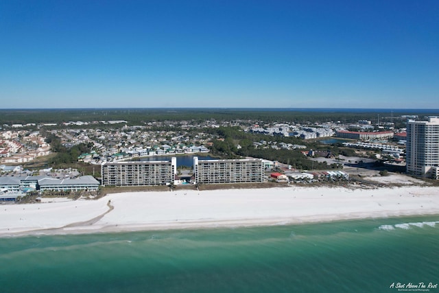 aerial view with a city view, a view of the beach, and a water view