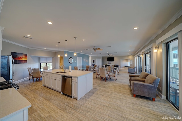 kitchen featuring visible vents, a sink, open floor plan, dishwasher, and a healthy amount of sunlight