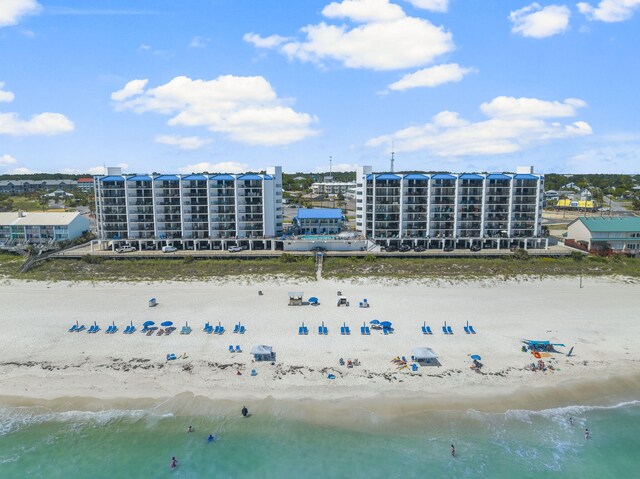 bird's eye view featuring a water view and a view of the beach