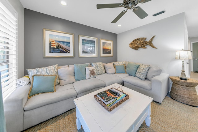 living room featuring a ceiling fan, recessed lighting, and visible vents