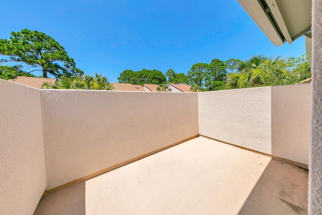 view of patio featuring a balcony