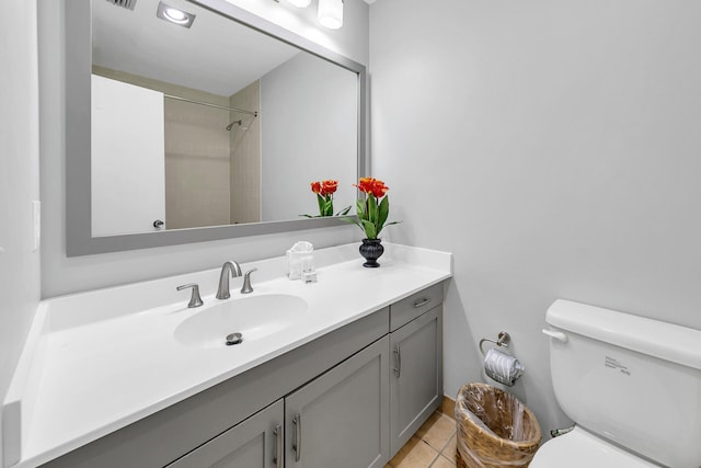 bathroom featuring visible vents, walk in shower, toilet, tile patterned floors, and vanity