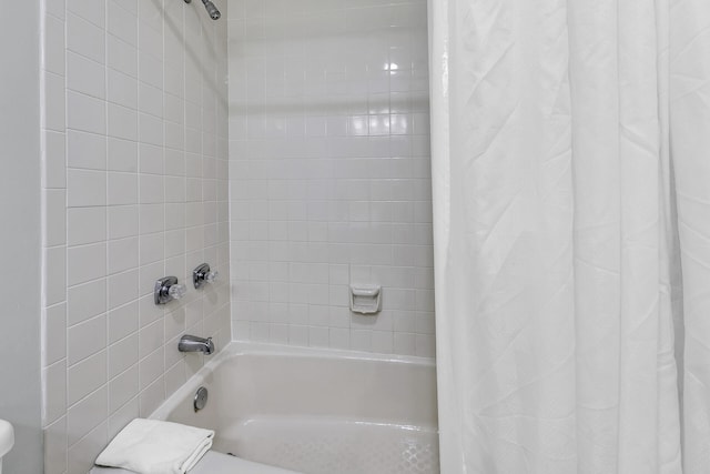 bathroom with shower / bath combination with curtain