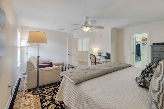 bedroom featuring visible vents, a ceiling fan, and baseboards