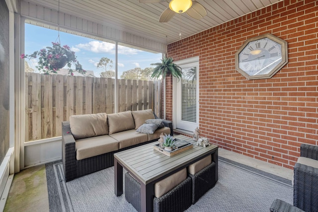 sunroom featuring ceiling fan