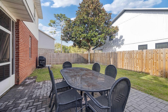 view of patio / terrace with a fenced backyard and outdoor dining space