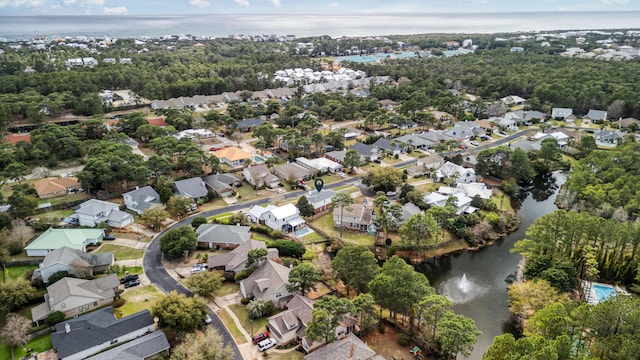 bird's eye view with a residential view and a water view