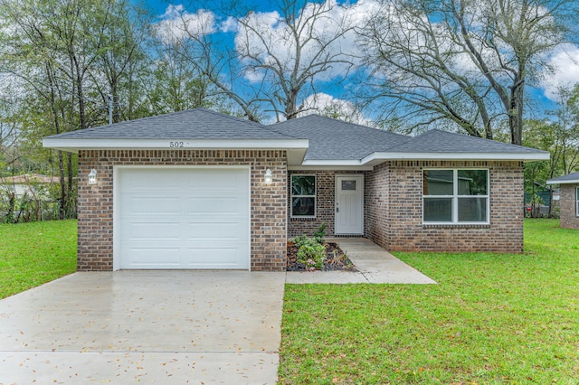 ranch-style home featuring driveway, roof with shingles, a front yard, an attached garage, and brick siding