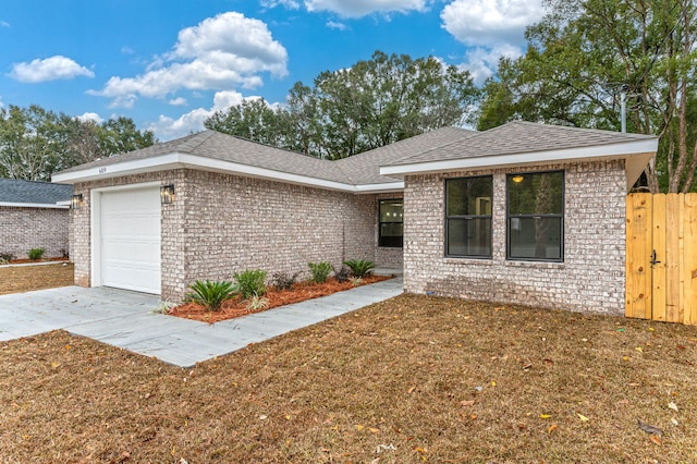 ranch-style house with a garage, brick siding, roof with shingles, and concrete driveway