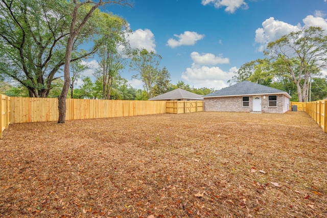 view of yard with a fenced backyard