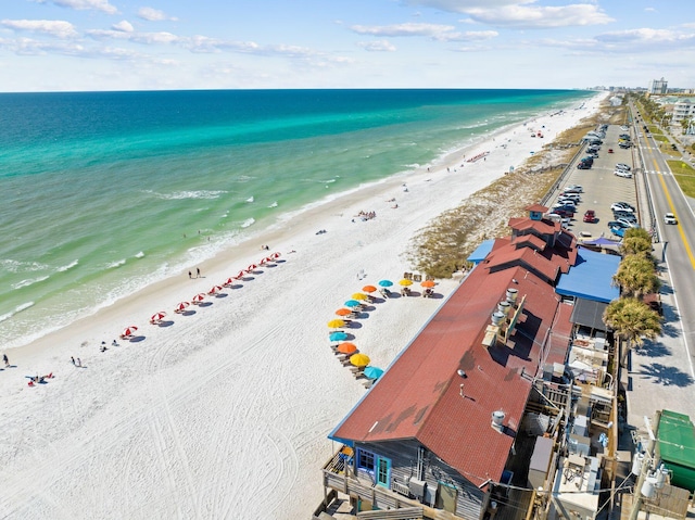 birds eye view of property featuring a view of the beach and a water view