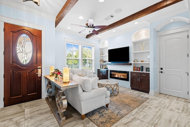 foyer with ceiling fan, visible vents, beamed ceiling, and a glass covered fireplace