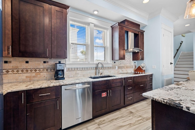 kitchen with ornamental molding, a sink, light stone counters, stainless steel dishwasher, and wall chimney range hood