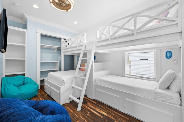 bedroom with recessed lighting, crown molding, and wood finished floors