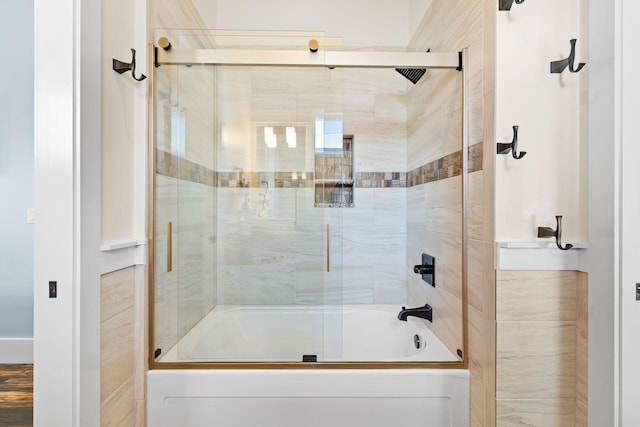 full bath with bath / shower combo with glass door