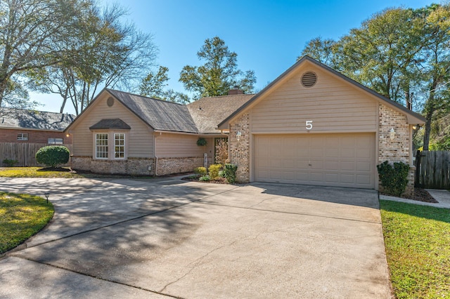 ranch-style house featuring driveway, fence, an attached garage, brick siding, and a chimney