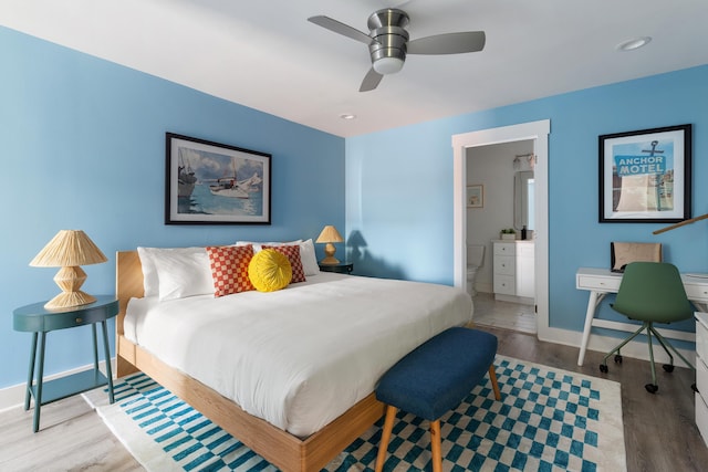 bedroom with a ceiling fan, wood finished floors, recessed lighting, connected bathroom, and baseboards