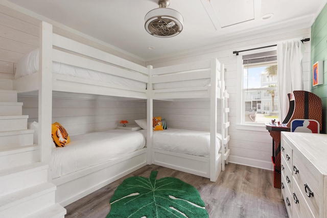 bedroom with light wood-style floors and baseboards