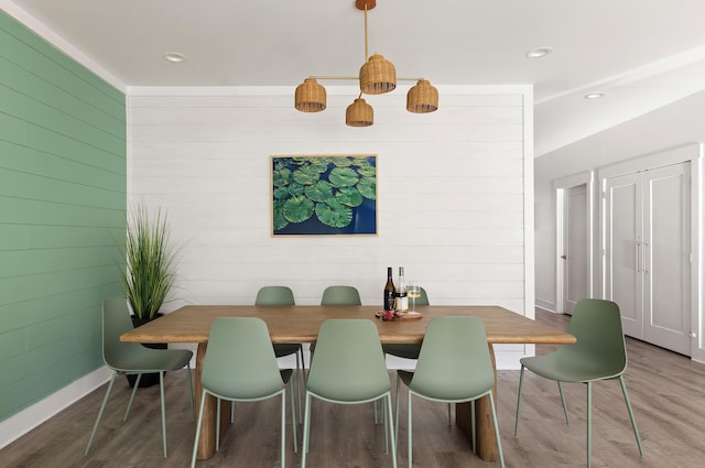 dining room with recessed lighting, baseboards, and wood finished floors