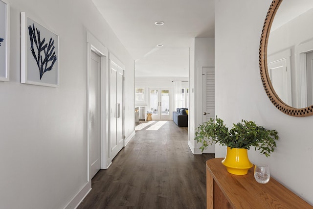 corridor with recessed lighting, french doors, baseboards, and dark wood-style flooring