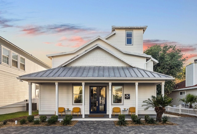 98 Shirah St, Destin, FL 32541 - view of front of home featuring metal roof, french doors, and a standing seam roof