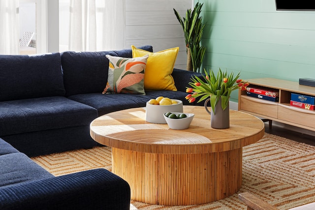 living room with wooden walls