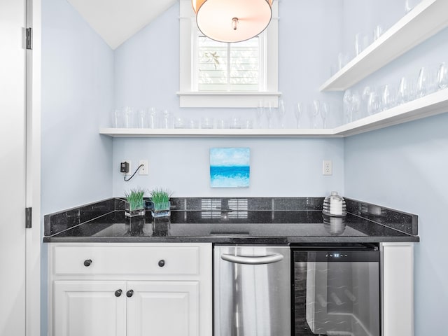 kitchen featuring wine cooler, white cabinets, dark stone counters, and open shelves