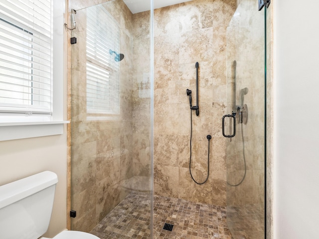 full bath with a shower stall and toilet