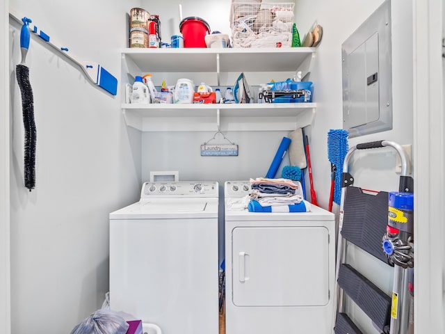 laundry area with electric panel, laundry area, and separate washer and dryer