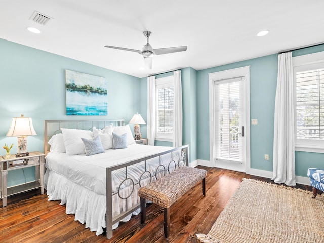 bedroom with visible vents, baseboards, recessed lighting, wood finished floors, and access to outside