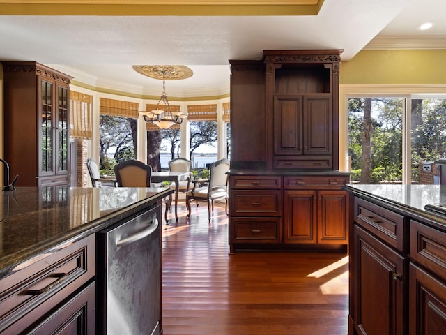 kitchen featuring a notable chandelier, pendant lighting, ornamental molding, open shelves, and dark wood-style floors