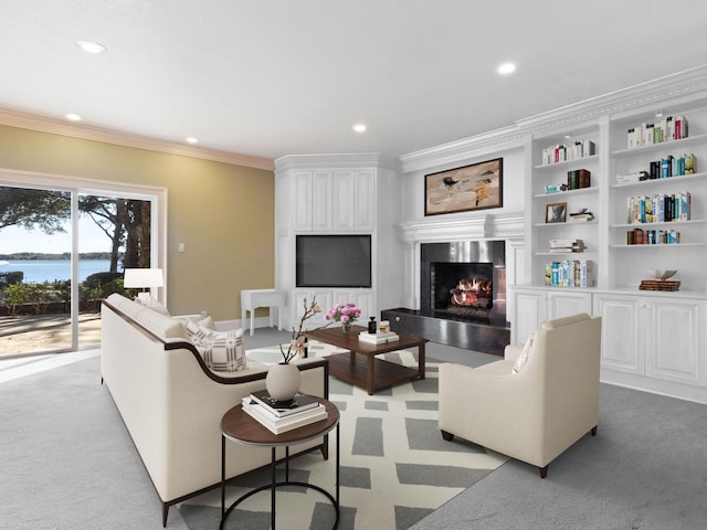 living room with light carpet, recessed lighting, crown molding, and a lit fireplace