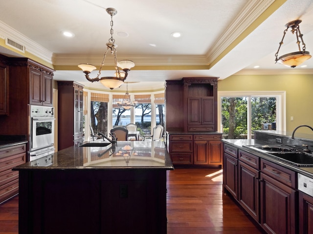 kitchen featuring dark wood-style floors, visible vents, open shelves, a sink, and a chandelier