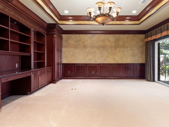 unfurnished living room with light carpet, built in study area, crown molding, and a tray ceiling