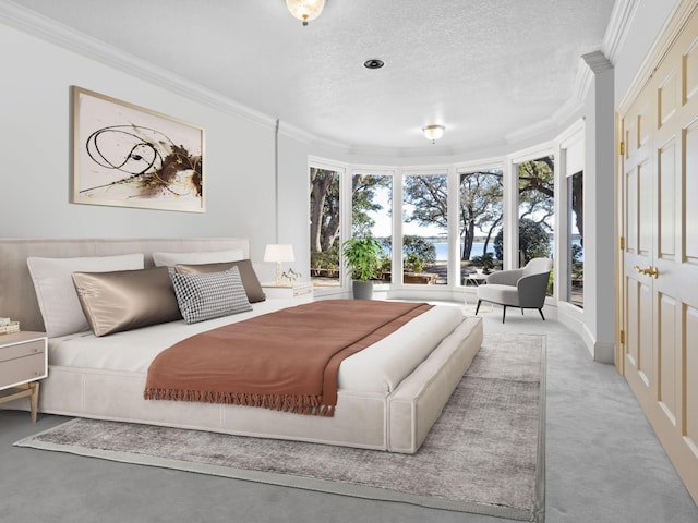 bedroom featuring a textured ceiling and ornamental molding