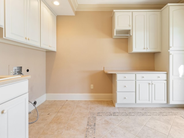 laundry room with hookup for a washing machine, light tile patterned floors, baseboards, cabinet space, and electric dryer hookup