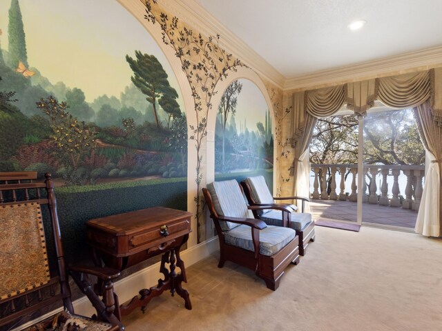 living area featuring crown molding and carpet floors