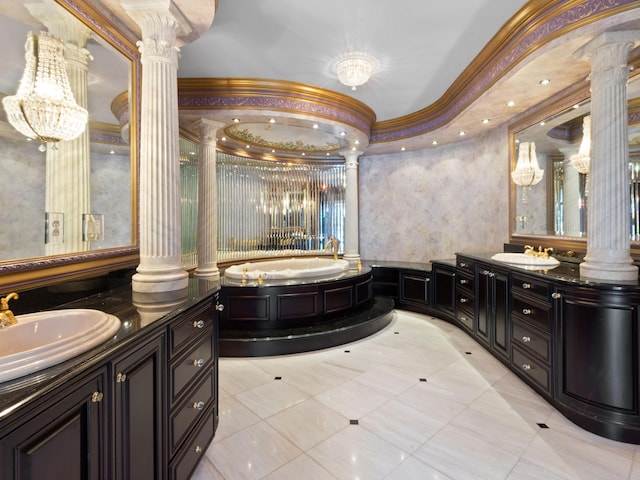 full bathroom with vanity, decorative columns, a bath, and ornamental molding