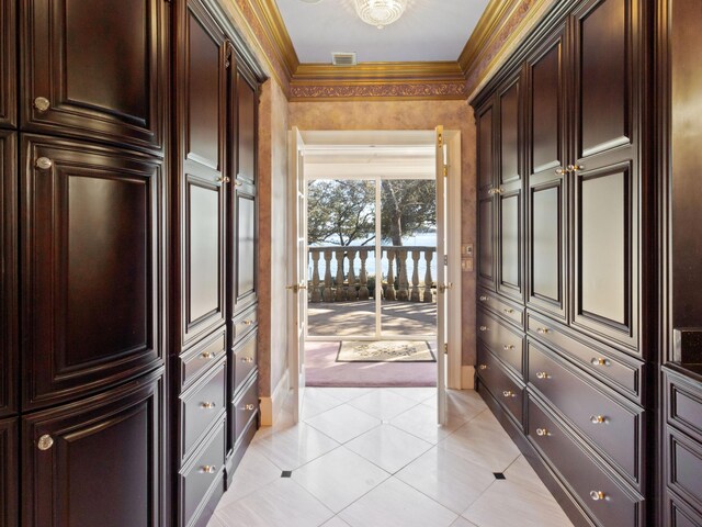 spacious closet featuring light tile patterned floors and visible vents